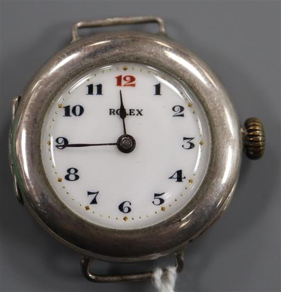 An early 20th century silver Rolex manual wind wrist watch with detached sterling flexible bracelet strap.